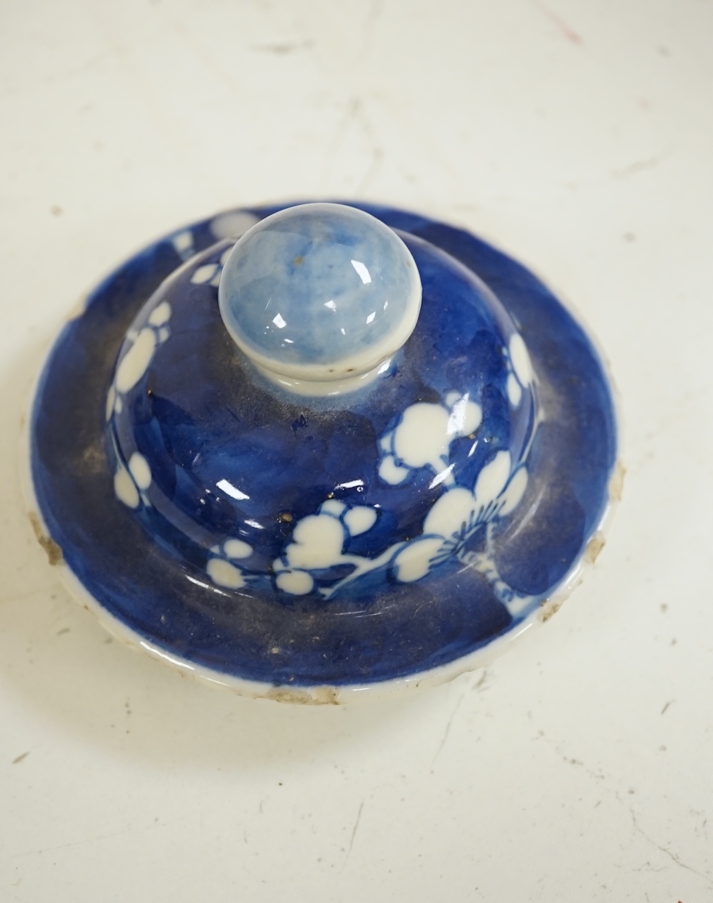 A group of five Chinese blue and white prunus vases, one with cover, late 19th century, tallest 20cm. Condition - varies